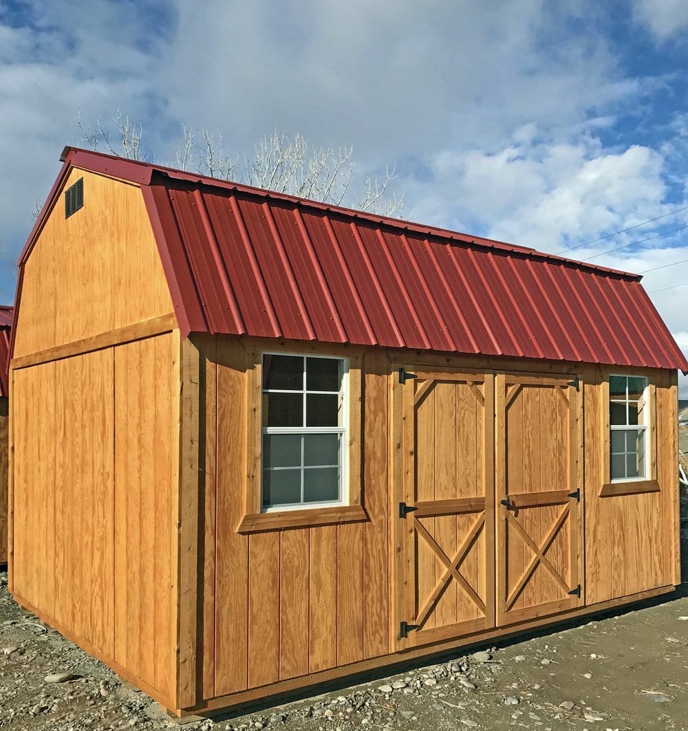 Side Lofted Barn Cabin with beautiful honey gold olympic wood stain. Rustic Red Metal Roof, double wood door (72 inches), two 2x3 windows.