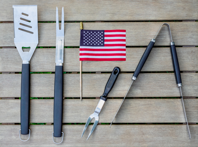 barbeque utensils with a mini American flag in the center